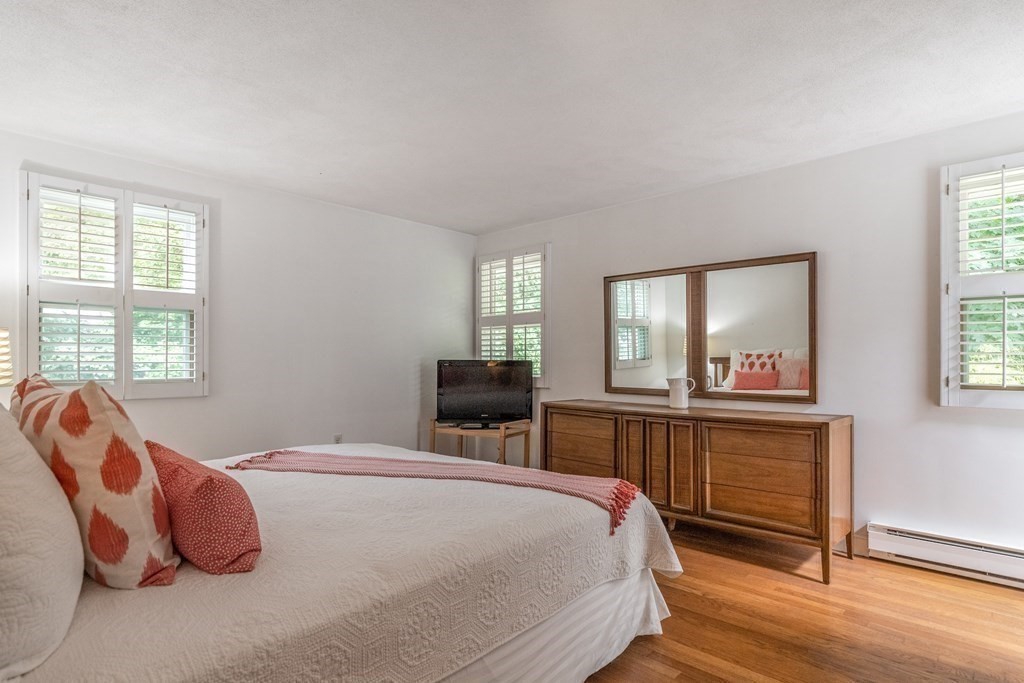 14 Driftwood Road Marblehead, MA 01945 - Photo 19 of 30 a bedroom with a bed and wooden floor