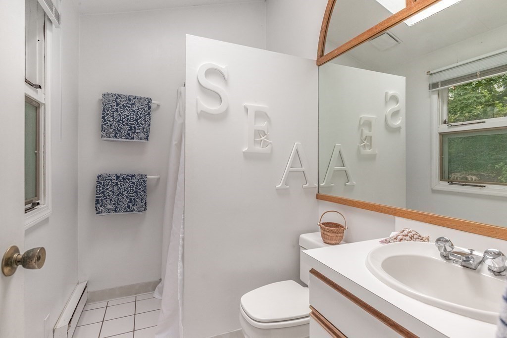 14 Driftwood Road Marblehead, MA 01945 - Photo 21 of 30 a bathroom with a sink toilet and shower