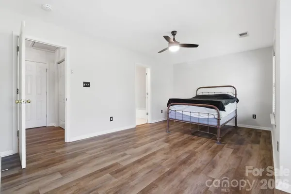 a living room with a bed and a window