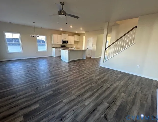 a view of kitchen with cabinets and wooden floor