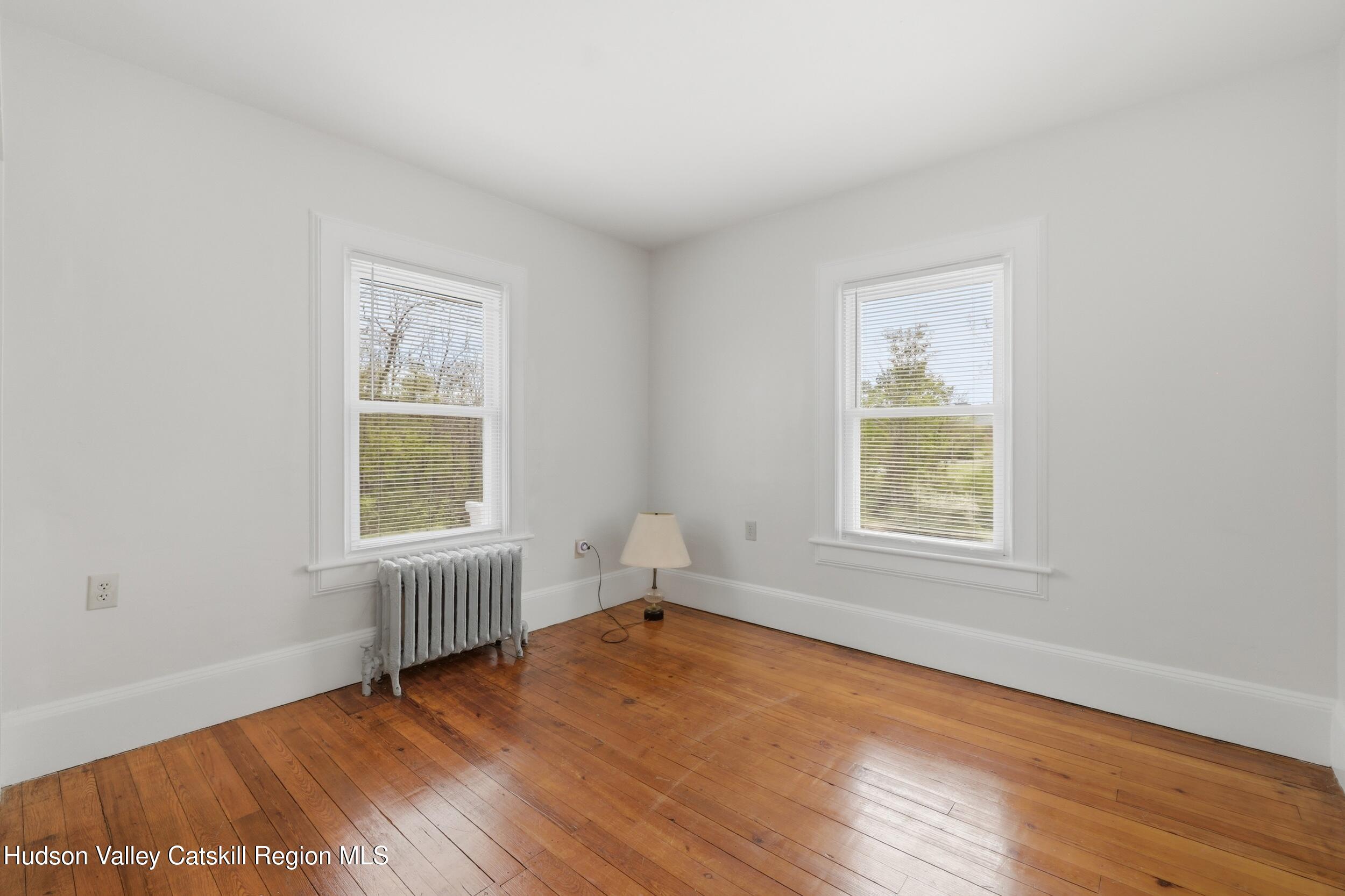 294 Kyserike Road Accord, NY 12404 - Photo 22 of 46 an empty room with wooden floor and windows