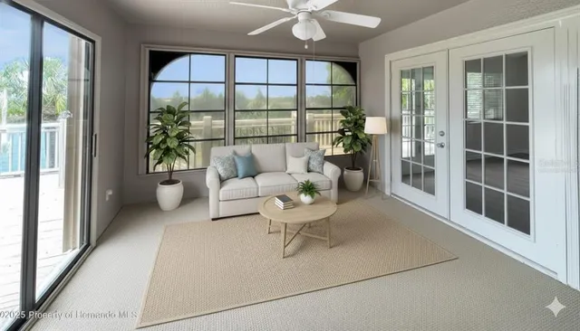 a living room with furniture and a large window