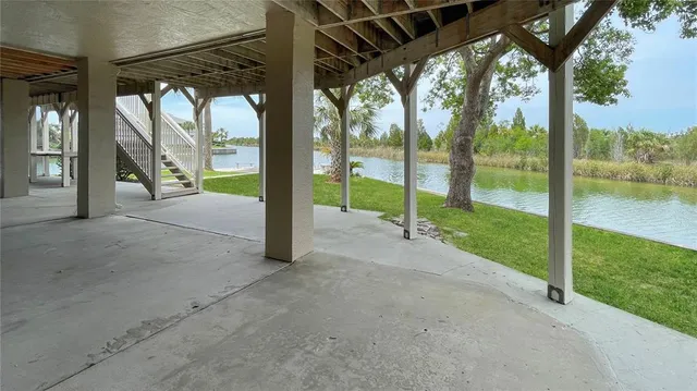 a front view of a house with a garden and yard