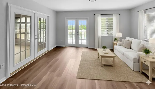 a living room with furniture and a large window