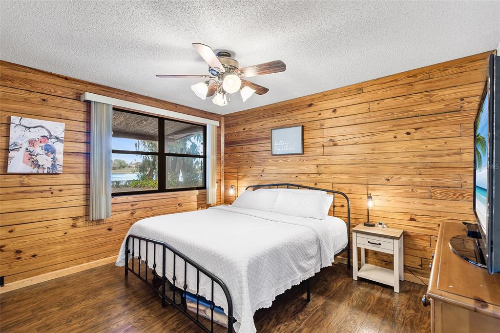 1233 St Anne Shrine Road Lake Wales, FL 33898 - Photo 11 of 47 a bedroom with a bed and a dresser next to a window