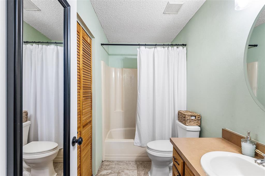 1233 St Anne Shrine Road Lake Wales, FL 33898 - Photo 13 of 47 a bathroom with a toilet a sink and a shower