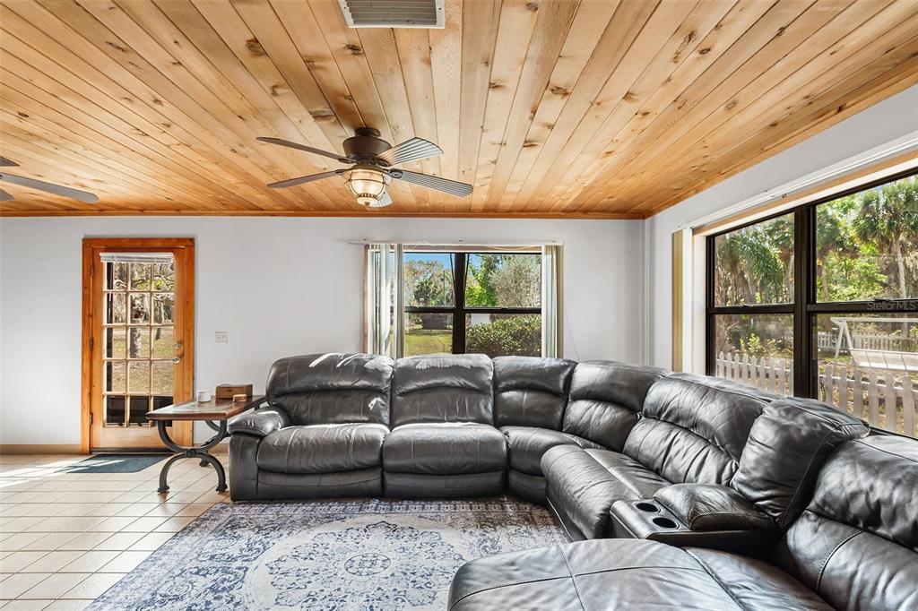 1233 St Anne Shrine Road Lake Wales, FL 33898 - Photo 16 of 47 a living room with furniture and a large window