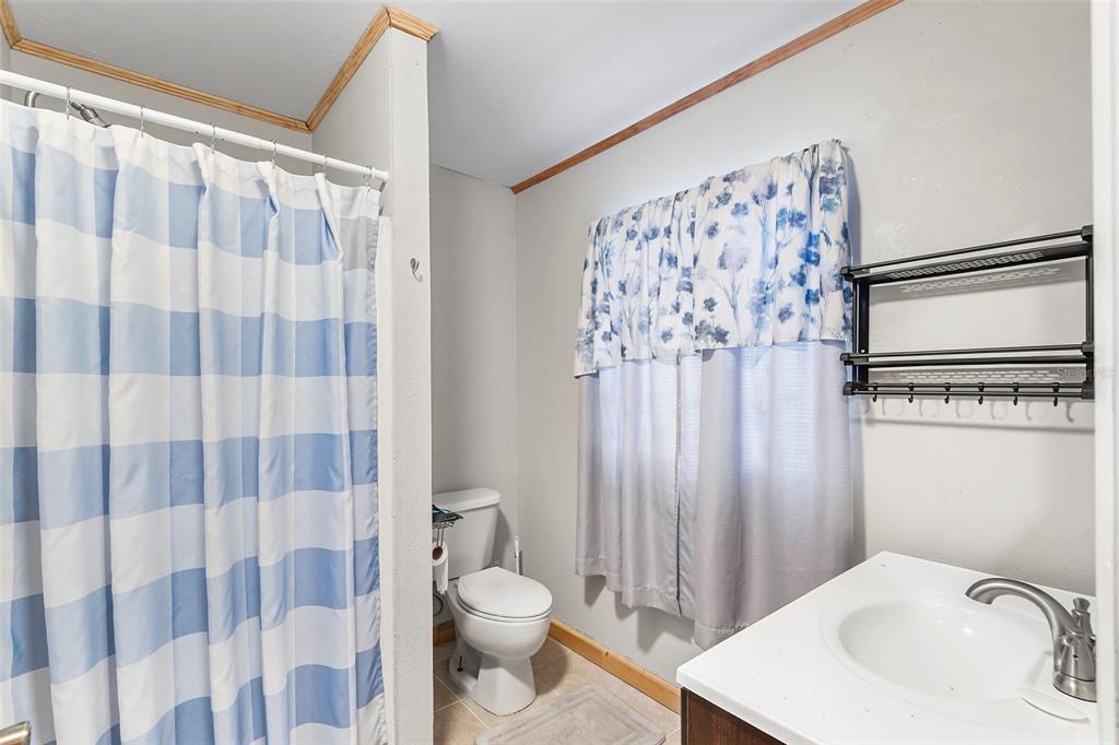 1233 St Anne Shrine Road Lake Wales, FL 33898 - Photo 26 of 47 a bathroom with a sink toilet and shower