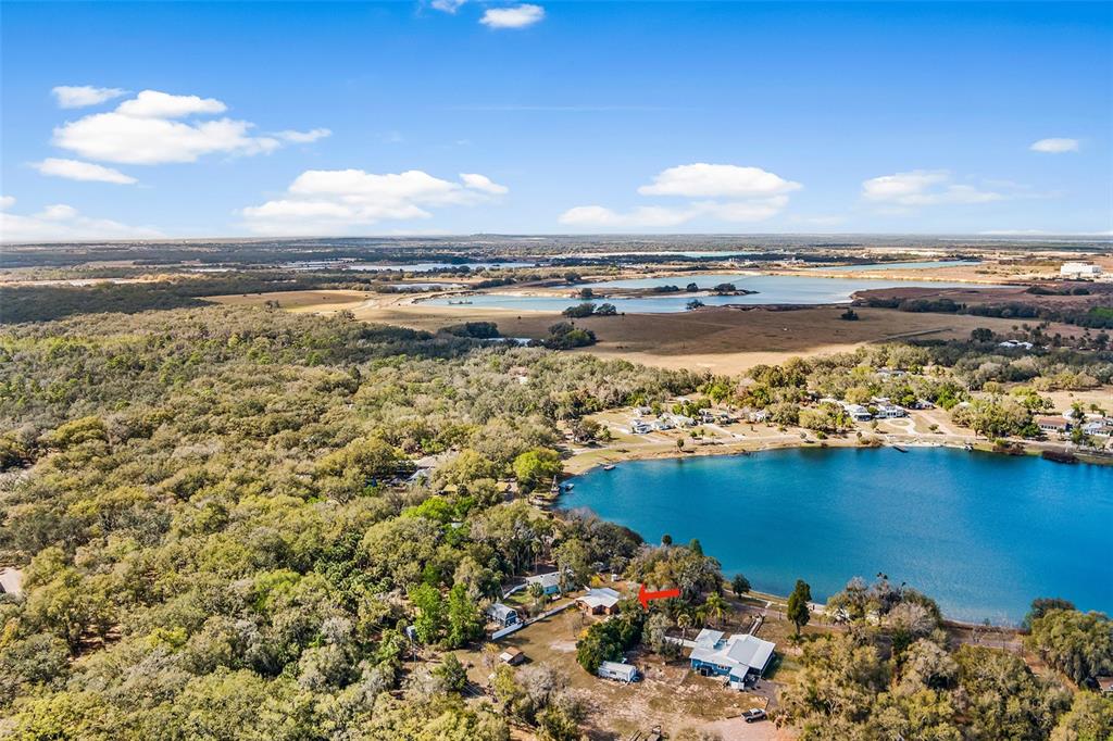1233 St Anne Shrine Road Lake Wales, FL 33898 - Photo 32 of 47 a view of a lake and a building