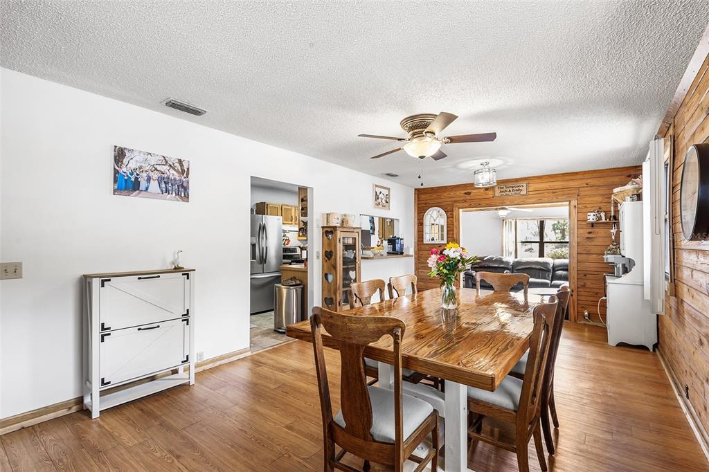 1233 St Anne Shrine Road Lake Wales, FL 33898 - Photo 6 of 47 a view of a dining room with furniture and wooden floor