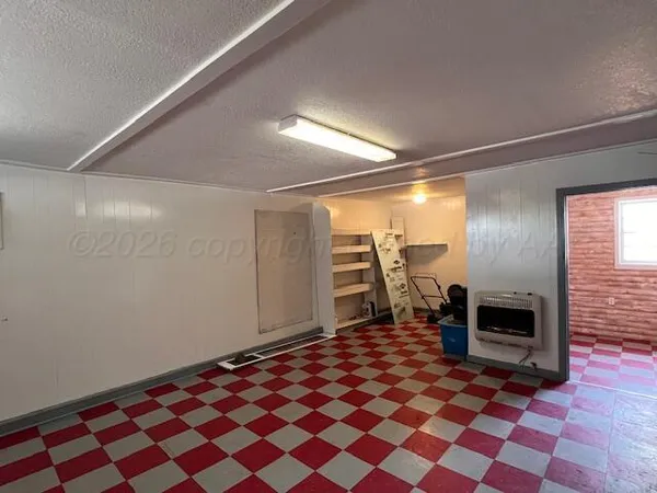a bedroom with a bed and a view of closet