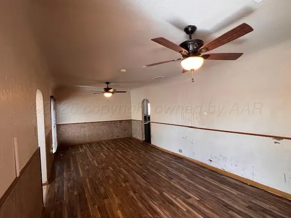 a view of a ceiling fan with wooden floor