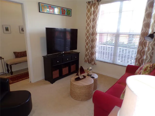 a room with a table and a potted plant