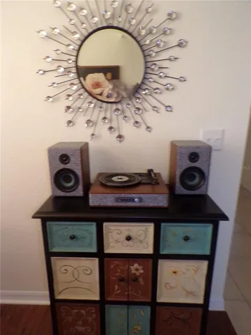 a living room with a fireplace and a rug