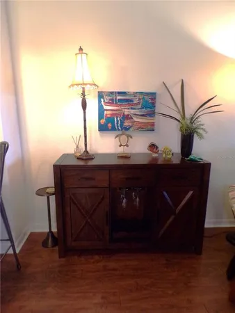 a living room with furniture and a rug