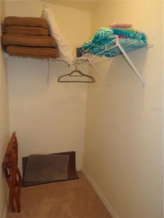 a workspace room with furniture and a window