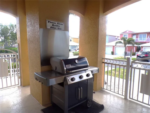 a view of a house with swimming pool and sitting area