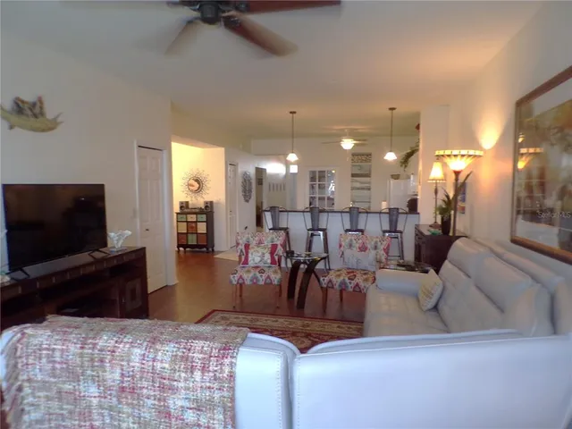 a large kitchen with kitchen island a sink stainless steel appliances and a counter top space