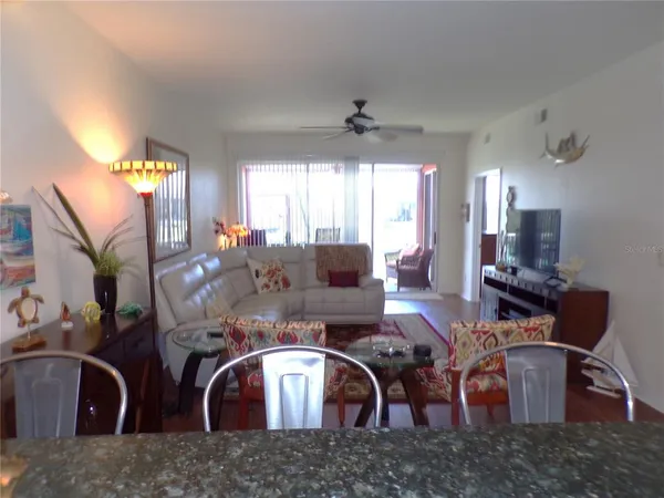 a view of a dining room with furniture window and wooden floor