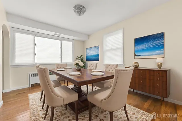a view of a dining room with furniture and wooden floor
