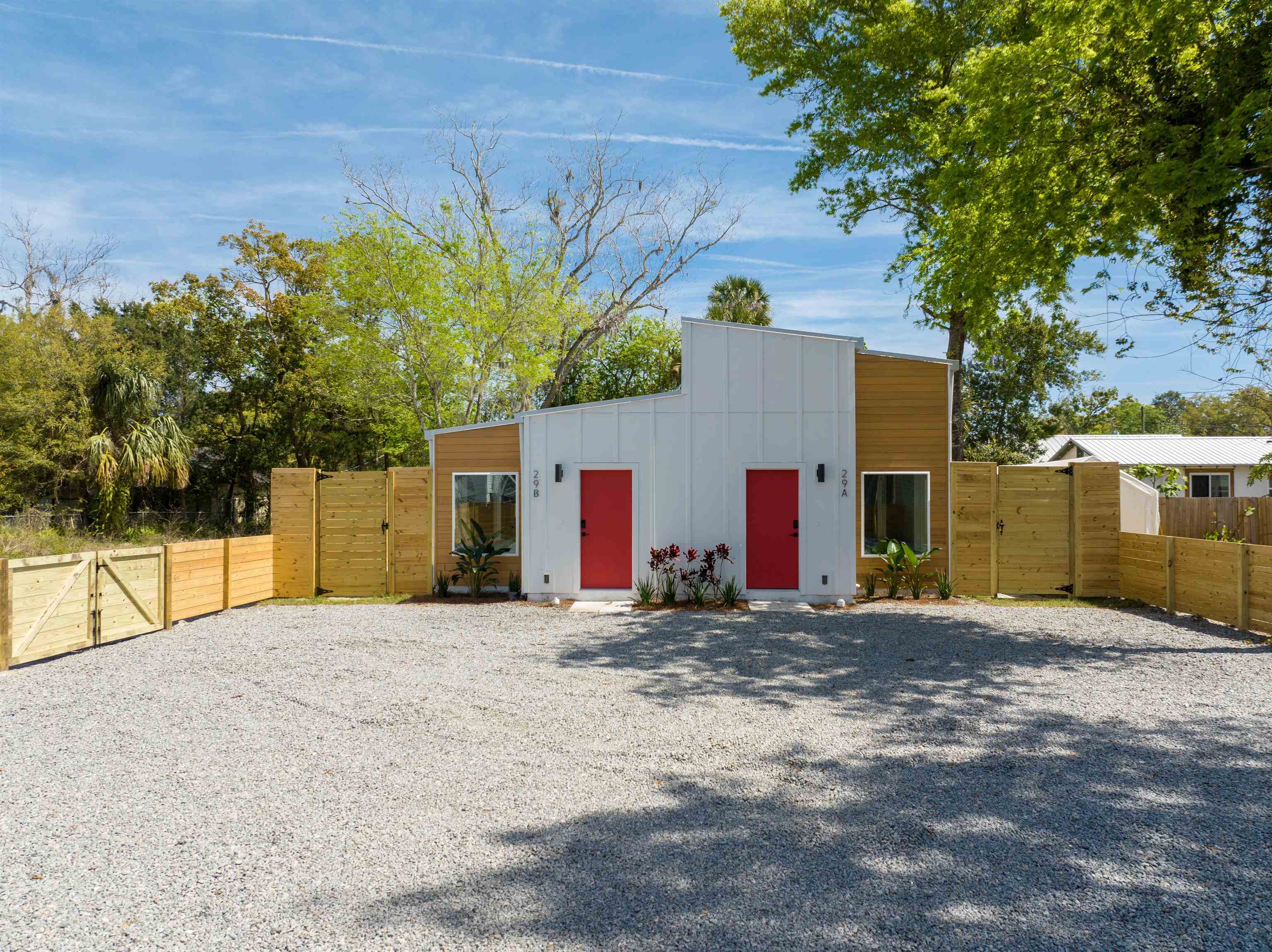 a view of a house with a yard and garage