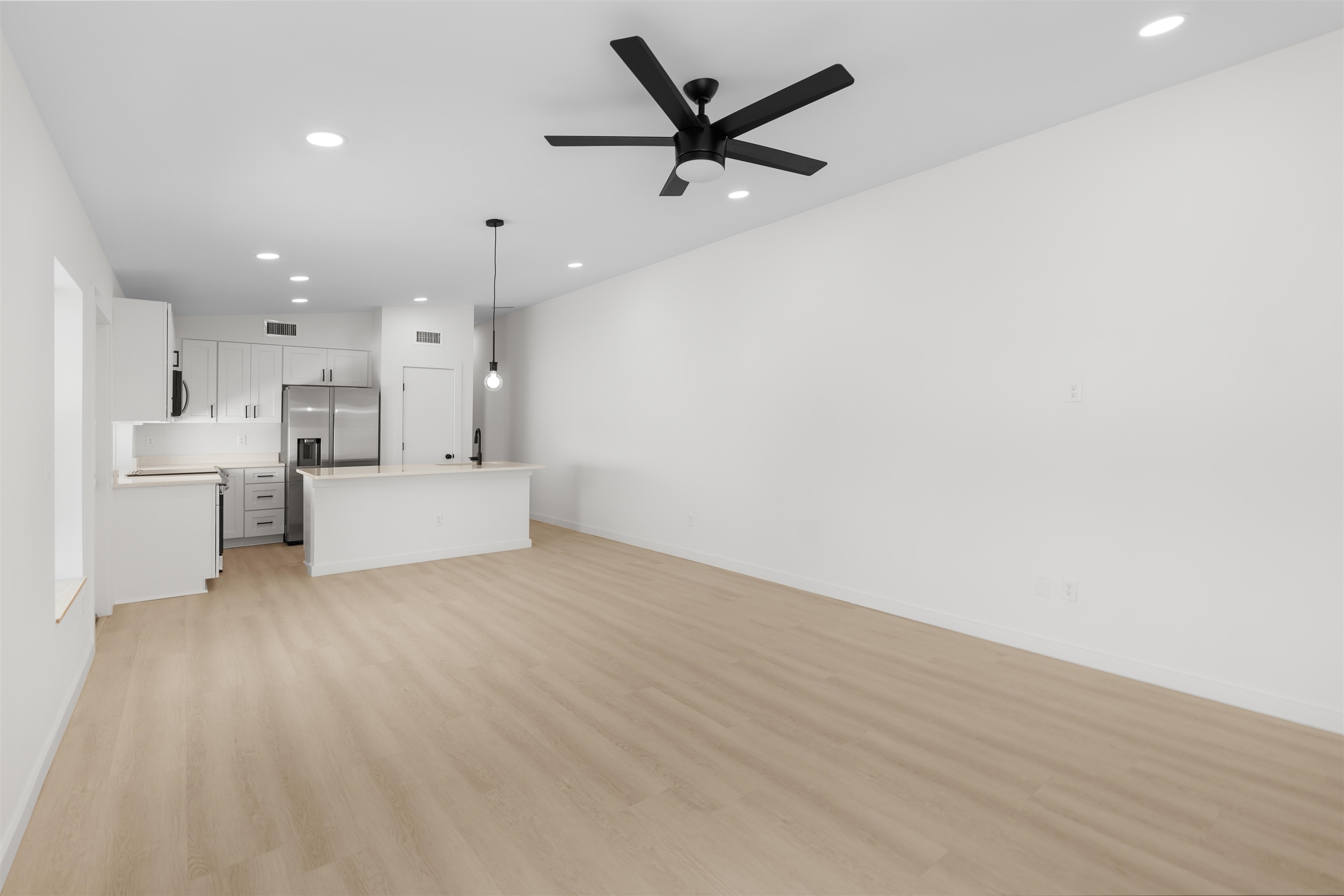 29 Masters Drive, Unit B St. Augustine, FL 32084 - Photo 15 of 28 a view of a livingroom with a hardwood floor and a ceiling fan