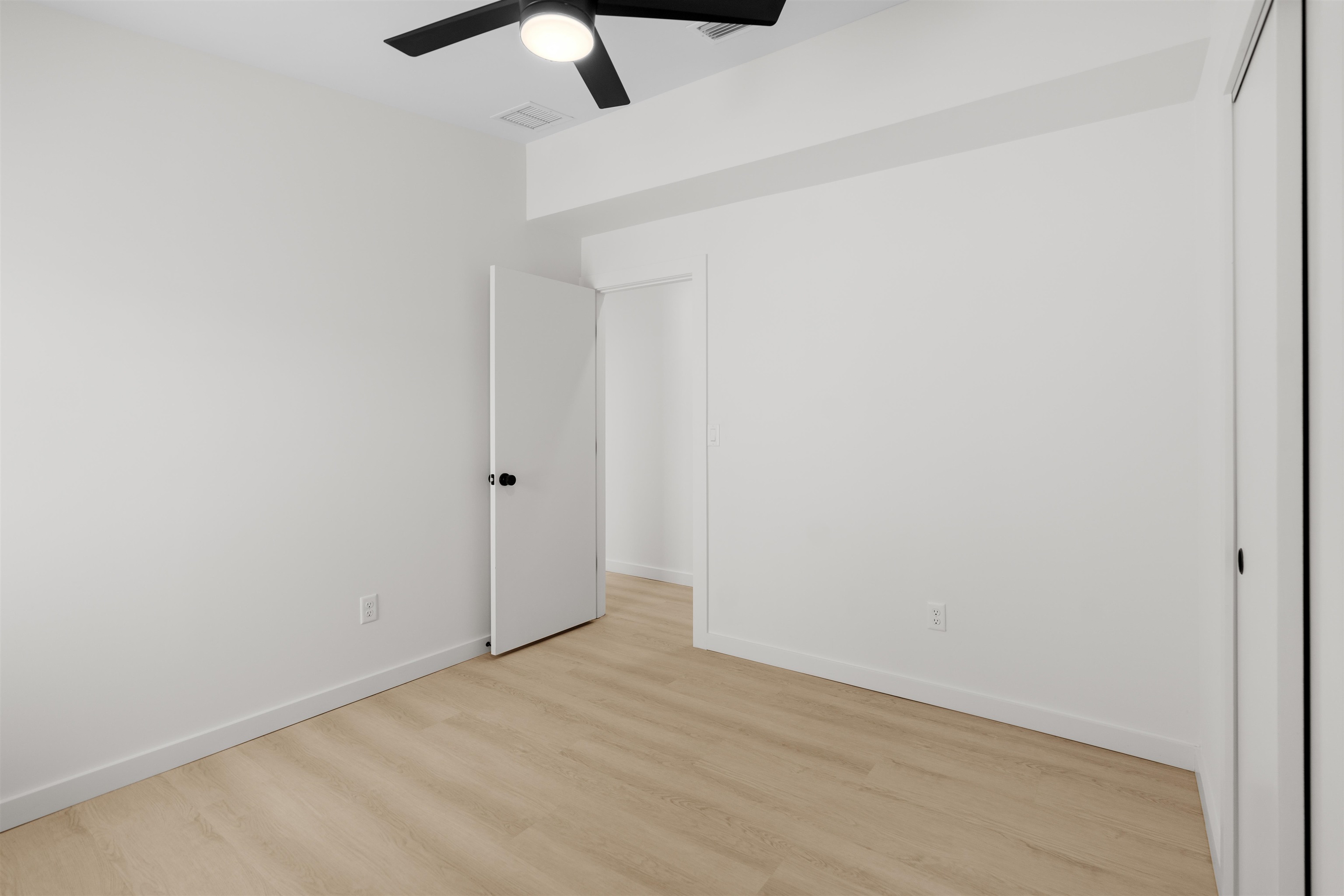 29 Masters Drive, Unit B St. Augustine, FL 32084 - Photo 8 of 28 an empty room with a ceiling fan and carpet