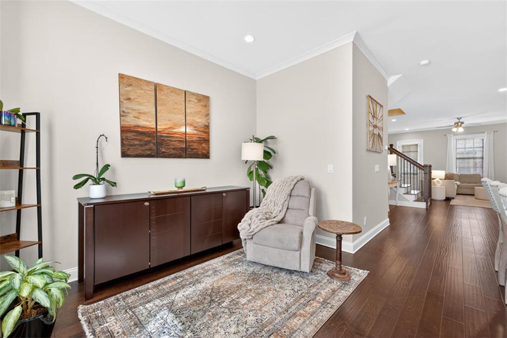 7012 Seneca Court Roswell, GA 30076 - Photo 18 of 65 a living room with furniture and a wooden floor