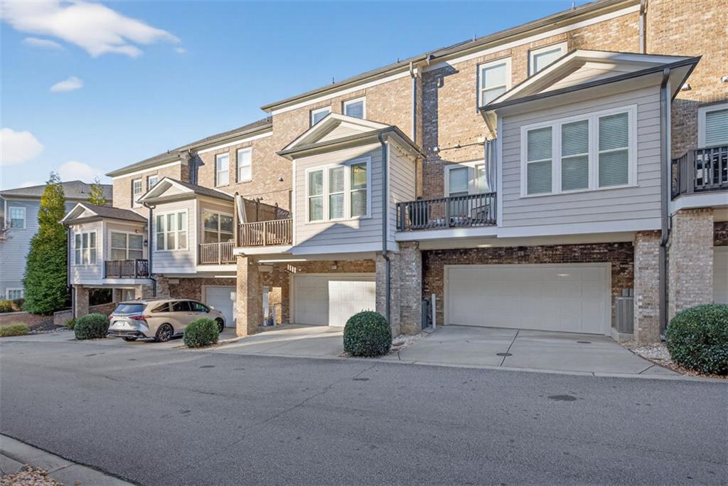 7012 Seneca Court Roswell, GA 30076 - Photo 53 of 65 a couple of cars parked in front of a building