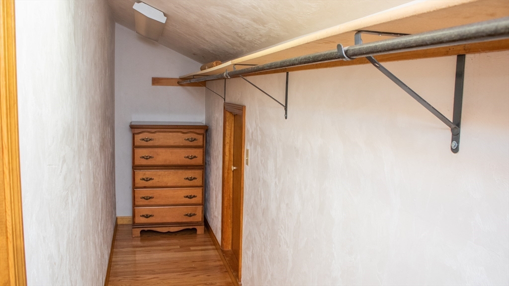 562 North Avenue Rochester, MA 02770 - Photo 18 of 32 a view of walk in closet with clothes