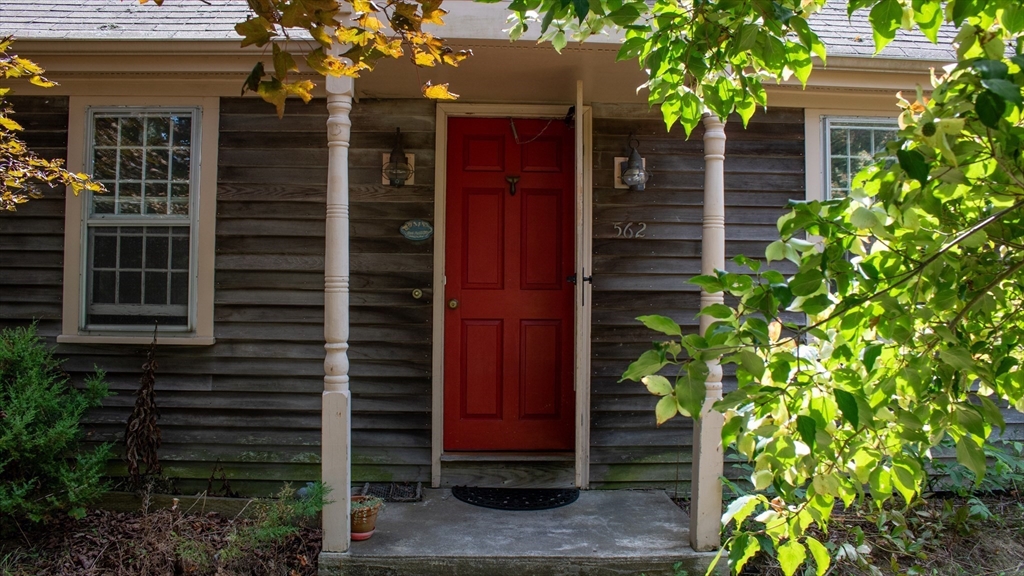 562 North Avenue Rochester, MA 02770 - Photo 3 of 32 a house view with a potted plant front of it