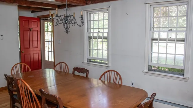 a dining room with furniture and window