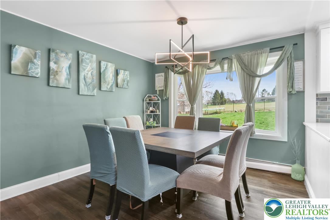 1042 Neffs Laurys Road Laurys Station, PA 18059 - Photo 10 of 27 a view of a dining room with furniture window and wooden floor