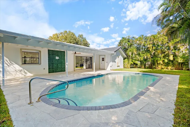 a view of outdoor space yard swimming pool and outdoor seating