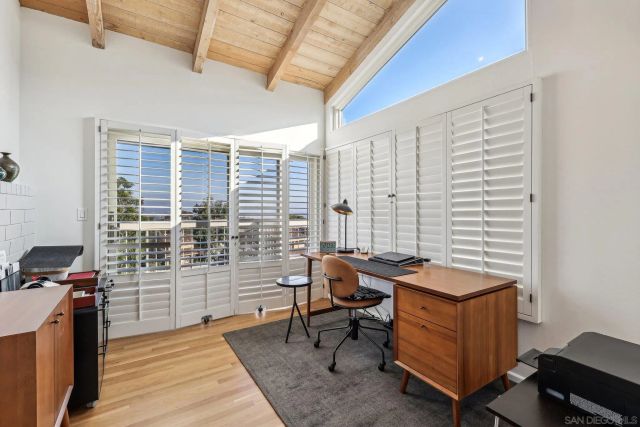 a bedroom with a bed and a dresser in it