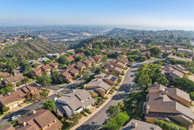 a aerial view of a house with a yard