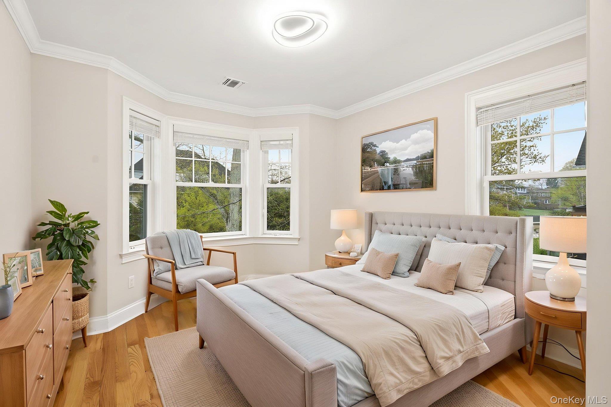 228 Central Avenue Rye, NY 10580 - Photo 15 of 24 a bedroom with a large bed and a window