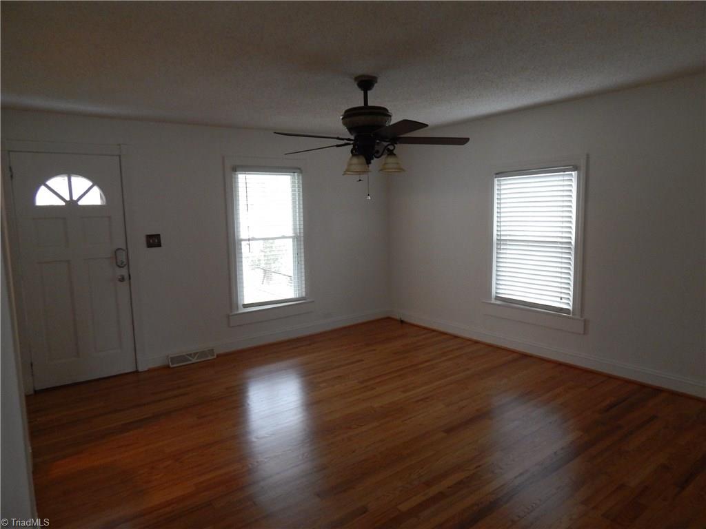 7830 Cherry Street Rural Hall, NC 27045 - Photo 2 of 21 Large living room - floors have been refinished.