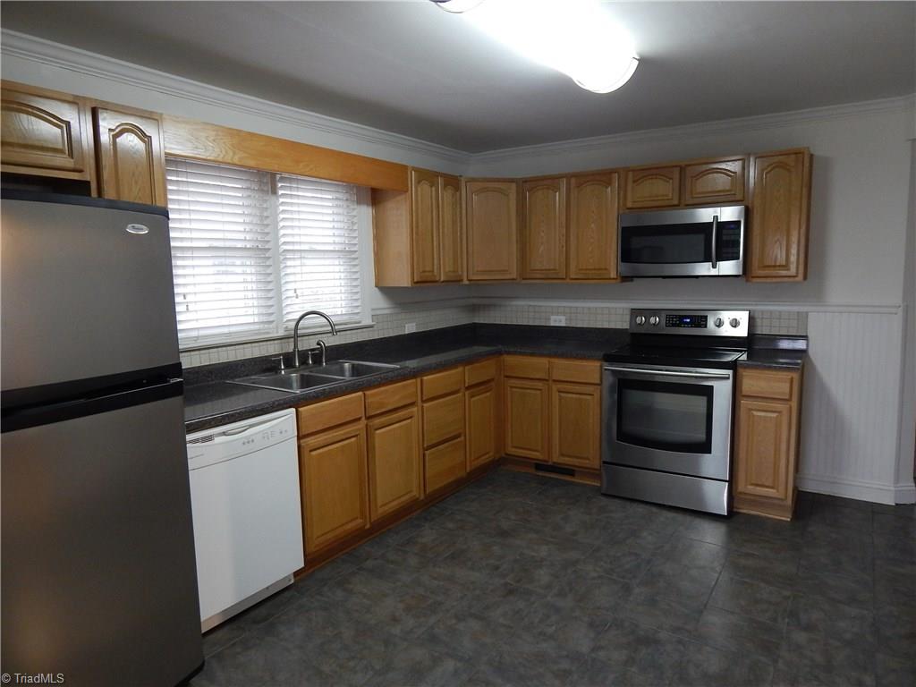 7830 Cherry Street Rural Hall, NC 27045 - Photo 4 of 21 Eat in kitchen with "almost" all stainless appliances (dishwasher was working to well to replace)!