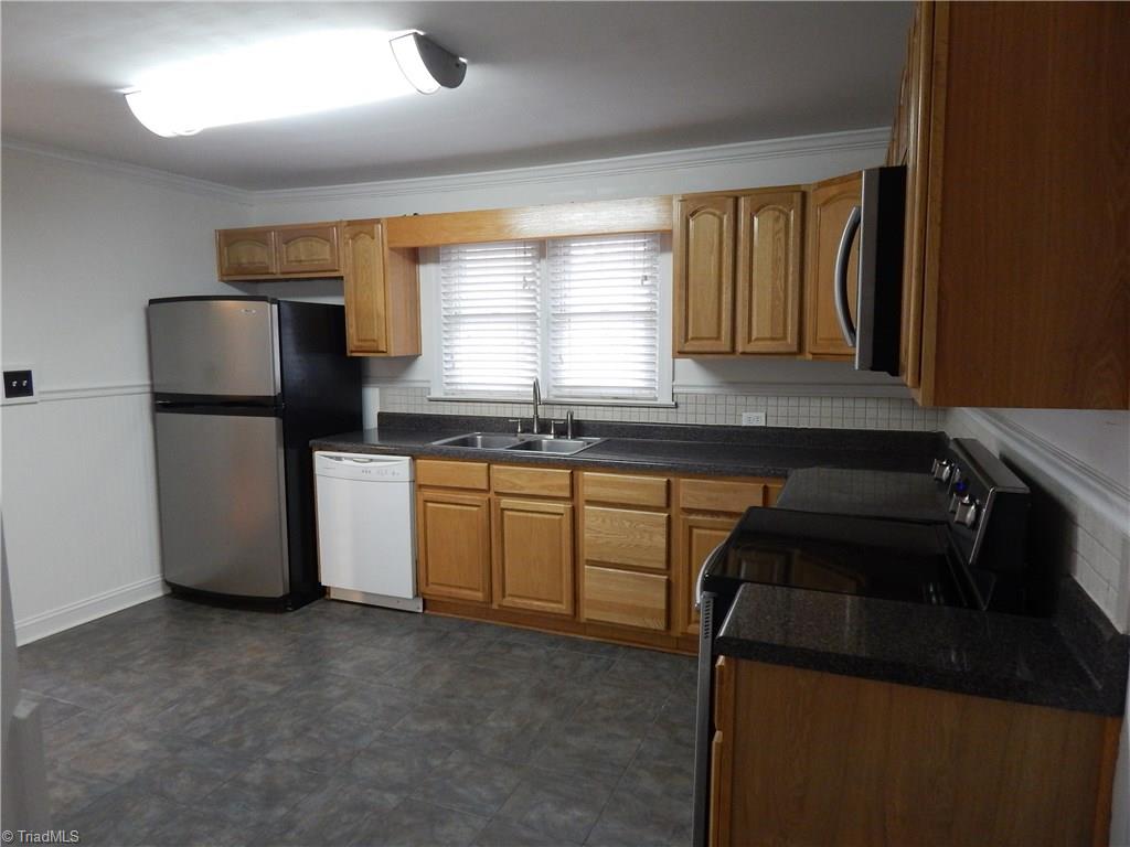 7830 Cherry Street Rural Hall, NC 27045 - Photo 5 of 21 Bright kitchen with tile flooring!