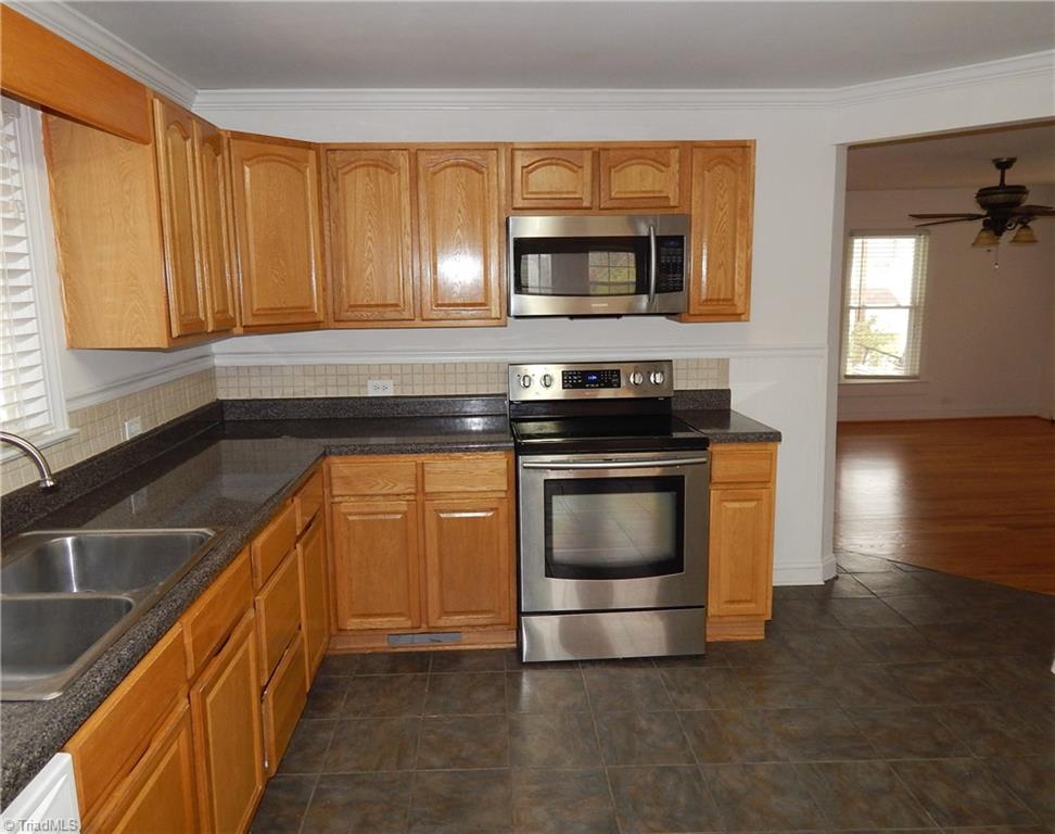 7830 Cherry Street Rural Hall, NC 27045 - Photo 7 of 21 Another view of the kitchen shows entry into living room.
