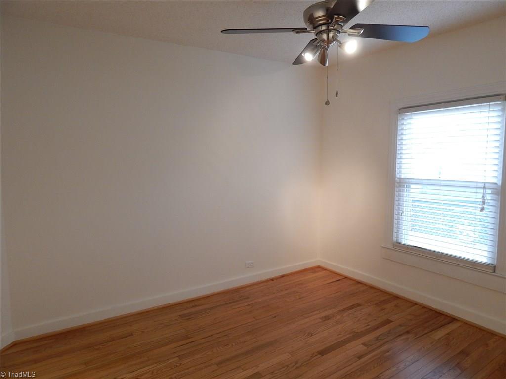 7830 Cherry Street Rural Hall, NC 27045 - Photo 9 of 21 Front bedroom also has hardwood flooring and nice ceiling fan!