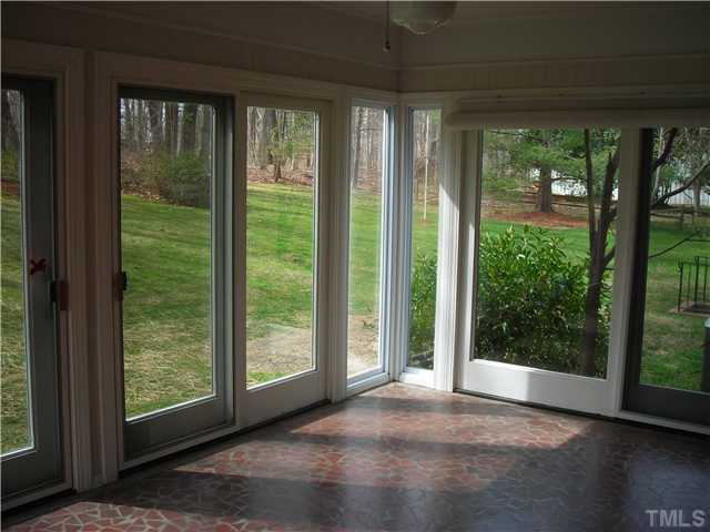 98 Roxdale Place Roxboro, NC 27574 - Photo 8 of 15 a view of a room with large windows and wooden floor