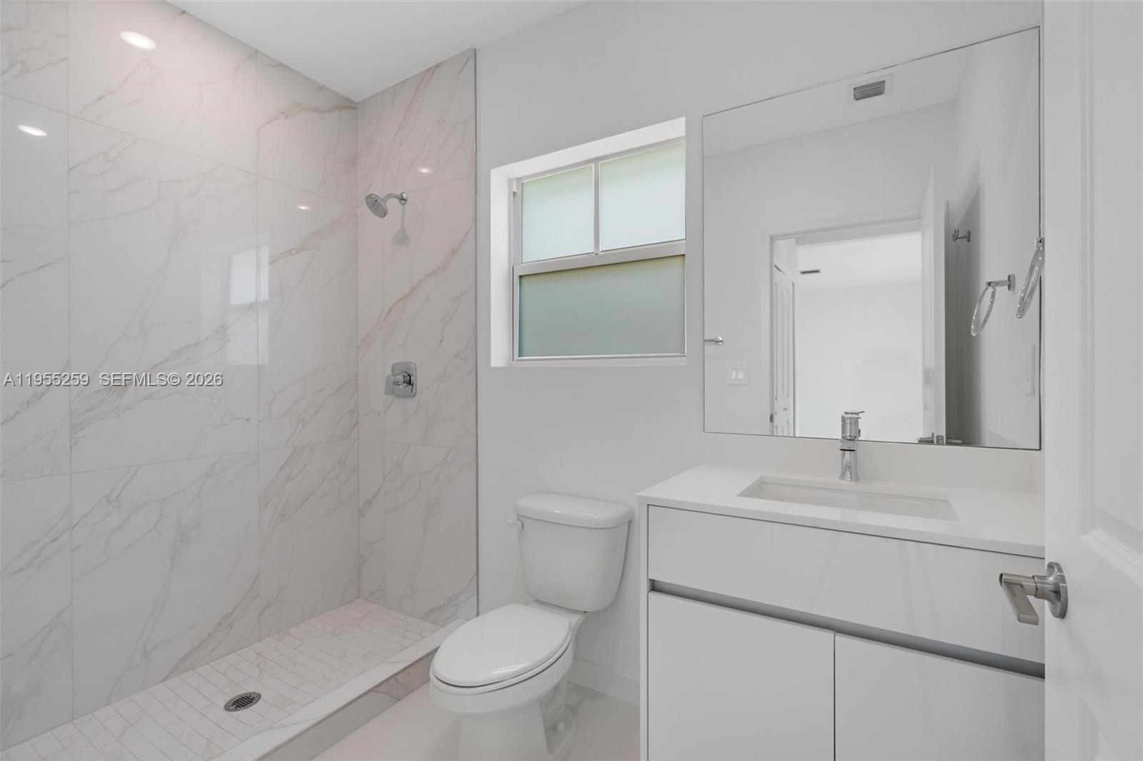 27319 Southwest 133rd Path Homestead, FL 33032 - Photo 12 of 32 a bathroom with a sink toilet and shower