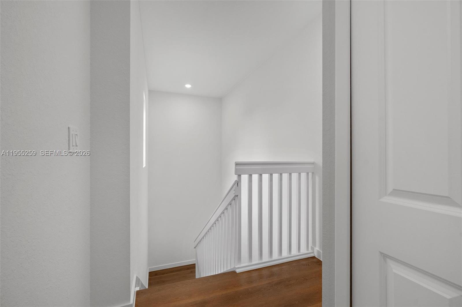 27319 Southwest 133rd Path Homestead, FL 33032 - Photo 18 of 32 a view of a hallway with wooden floor