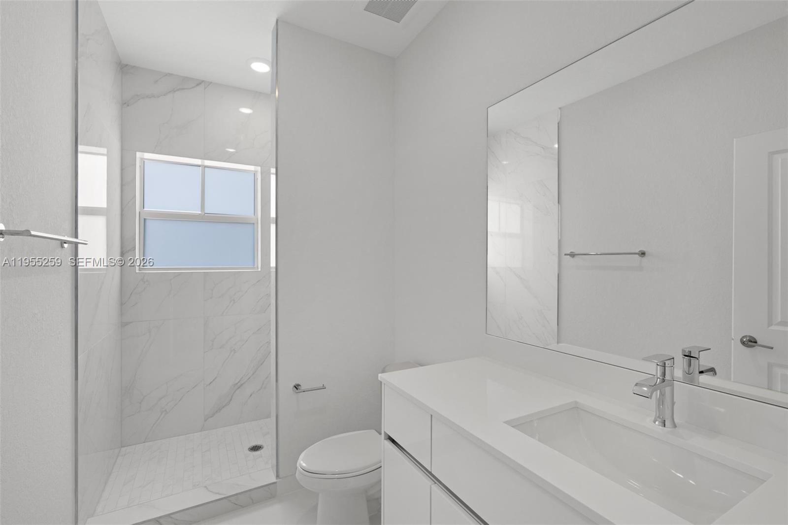 27319 Southwest 133rd Path Homestead, FL 33032 - Photo 27 of 32 a bathroom with a sink toilet and shower