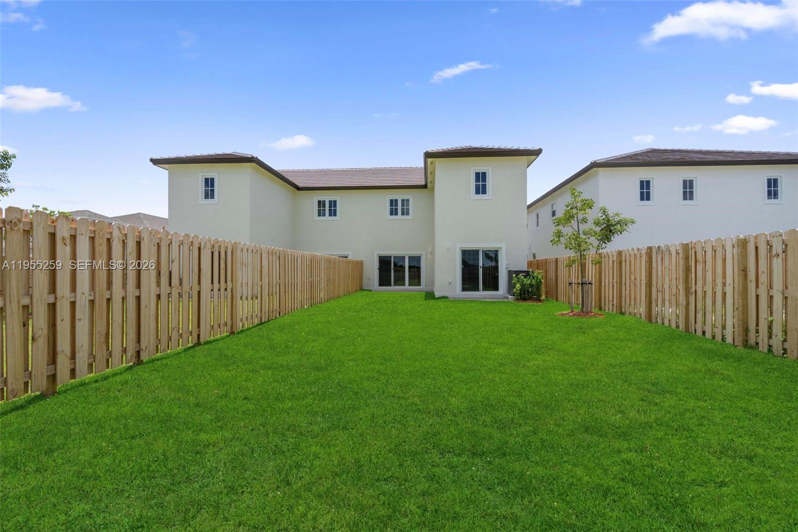 27319 Southwest 133rd Path Homestead, FL 33032 - Photo 29 of 32 a house view with a garden space