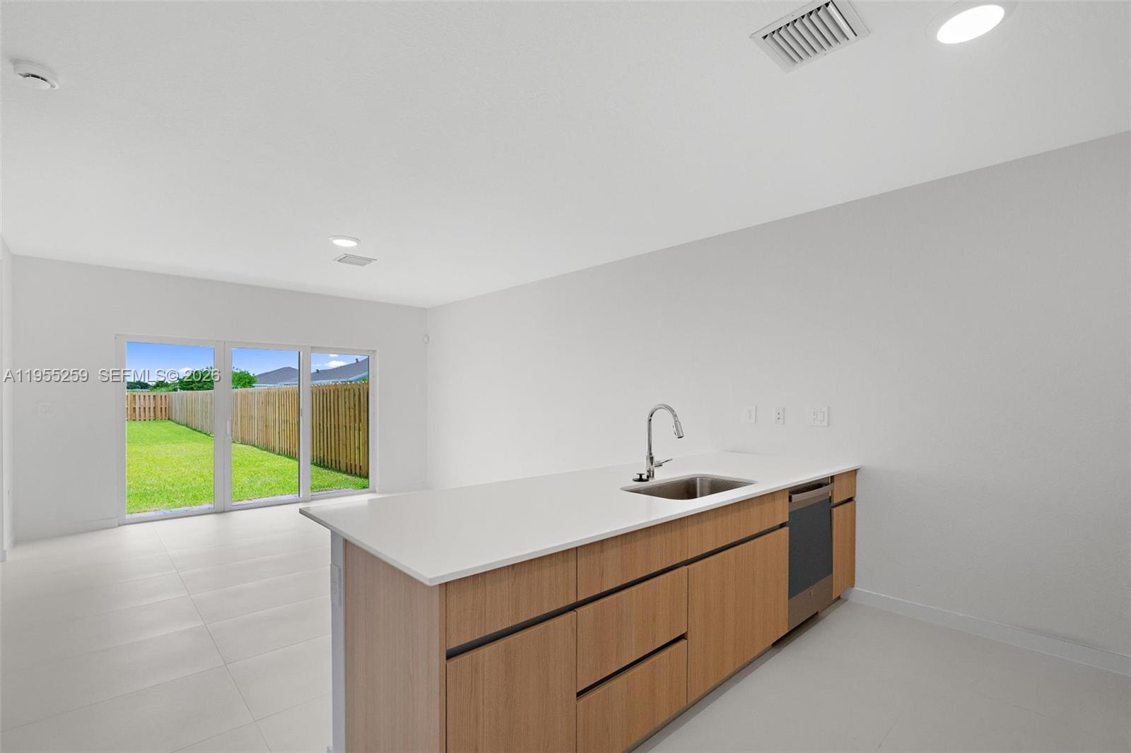 27319 Southwest 133rd Path Homestead, FL 33032 - Photo 7 of 32 a room with a sink and a window