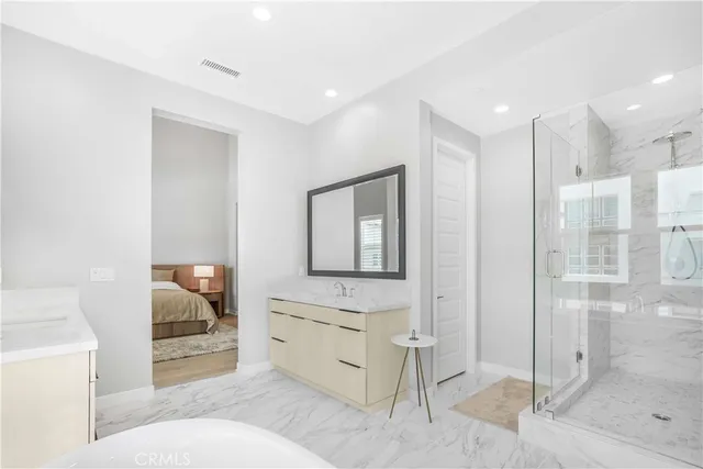 a bathroom with a toilet sink and shower