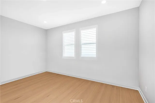 a bedroom with two beds and a closet